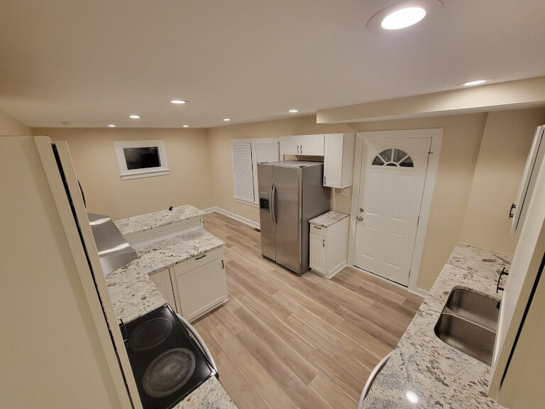 Completed Columbus kitchen remodel by iSpec — white cabinets, stone counters, stainless appliances